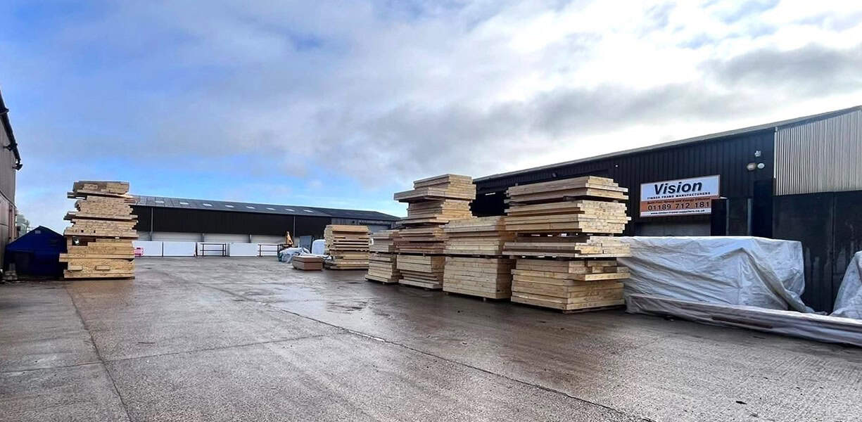 Transporting timber to build a timber frame house by Vision Development